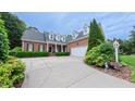 Beautiful brick home with an attached garage and a meticulously designed driveway at 119 Georgetowne Dr, Elon, NC 27244