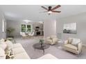 Bright and airy living room with an open floor plan, modern furnishings, and stylish decor at 1211 Freeman Dr, Sanford, NC 27330