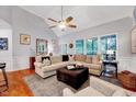 Inviting living room featuring a vaulted ceiling, comfortable seating, and large windows at 1216 Miracle Dr, Wake Forest, NC 27587