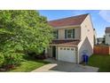 Inviting two-story home showcasing neutral siding, green shutters, a one-car garage, and lush green lawn at 1310 Silver Dr, Mebane, NC 27302