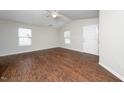 Bright living room with sleek, modern floors, neutral walls, and natural light at 202 Homestead Park Dr, Apex, NC 27502