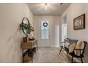 Bright entryway with console table, stylish mirror, and wood bench at 2426 Heron Watch Pl, Fuquay Varina, NC 27526