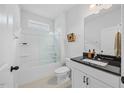 Clean bathroom with a shower-tub combo, a large vanity, and great lighting at 247 Axis Deer Ln, Garner, NC 27529