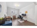 Home office with hardwood floors, lots of natural light, and a spacious desk area at 247 Axis Deer Ln, Garner, NC 27529