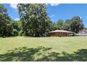 Expansive, well-maintained yard surrounding a charming brick home, perfect for outdoor activities and relaxation at 28 White Oak Dr, Smithfield, NC 27577