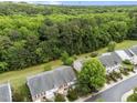 Aerial view of townhomes surrounded by lush green trees and well-maintained landscaping at 2950 Settle In Ln, Raleigh, NC 27614