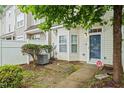 Well-kept townhome with pleasant landscaping, a tidy fenced yard, and a cozy front porch at 300 Gilman Ln # 101, Raleigh, NC 27610