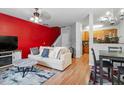 Comfortable living room with an accent wall, neutral-toned sofa, and bright, open layout at 300 Gilman Ln # 101, Raleigh, NC 27610