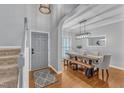 Elegant dining room with hardwood floors, contemporary lighting, and stylish furniture, perfect for entertaining at 4028 Winecott Dr, Apex, NC 27502