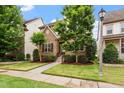 Attractive home with a stone facade, manicured lawn, and mature trees at 5003 Blue Jack Oak Dr, Cary, NC 27519