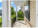 Cozy balcony space with stone facade, perfect for enjoying the outdoors at 5011 Peachtree Town Ln, Knightdale, NC 27545