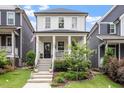 Charming two-story home featuring a welcoming front porch, landscaped yard, and inviting curb appeal at 586 Great Ridge Pkwy, Chapel Hill, NC 27517