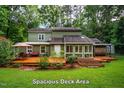 A spacious deck area that is ideal for relaxation and entertaining, with seamless indoor-outdoor living at 69 Margaret Pl, Chapel Hill, NC 27516