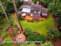 Enjoy outdoor living with the beautifully landscaped backyard, fire pit, and mature trees at 69 Margaret Pl, Chapel Hill, NC 27516