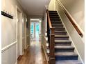 Inviting foyer boasts hardwood floors, staircase, and access to various rooms at 8620 Brookdale Dr, Raleigh, NC 27613