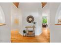 Inviting foyer with sleek hardwood flooring, accented by warm lighting and neutral walls with stylish decor at 8821 Oconee Ct, Chapel Hill, NC 27516