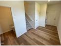 Inviting entryway with wood floors, a staircase, a storage closet, and natural light at 10517 Brookside Reserve Rd, Raleigh, NC 27614