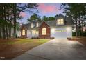 Beautiful two-story home with brick accents, white siding, and a well-maintained lawn at 106 Eagle Crest Ln, Princeton, NC 27569