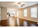 Spacious living room with wood floors that leads to the kitchen at 107 Kimeo Way, Garner, NC 27529