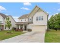 Attractive two-story home featuring a driveway, attached garage, and well-maintained front yard at 110 Gallery Park Dr, Franklinton, NC 27525