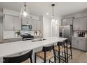A gorgeous kitchen island with a sink and barstool seating at 1215 Everton Ave, Durham, NC 27703