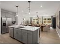 A gourmet kitchen with an island that features a stainless steel dishwasher at 1215 Everton Ave, Durham, NC 27703