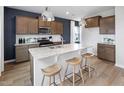 Modern kitchen with granite countertops, stainless steel appliances, and a large center island at 1517 Tamarisk Ln, Durham, NC 27703