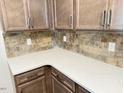 Close-up of the beautiful countertops and backsplash in this kitchen with modern cabinetry at 1998 Meadowview Dr, Graham, NC 27253