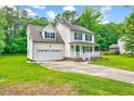 Attractive two-story home with a garage and a well-maintained front lawn at 212 Spearhead Pl, Clayton, NC 27520
