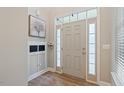 Bright entryway with beautiful wood floors, coat rack, and lots of natural light at 215 Outwater Ridge Dr, Garner, NC 27529