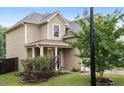 Exterior shot of a well-maintained home with a lush lawn and inviting front entrance at 215 Outwater Ridge Dr, Garner, NC 27529