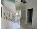 Unfinished entry with stairs and an open floor plan leading to the living areas and natural light at 256 Meadowbark Bnd # 45, Garner, NC 27529