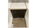 Showcasing a neutral-toned countertop, dark cabinet door, and luxury vinyl flooring at 256 Meadowbark Bnd # 45, Garner, NC 27529