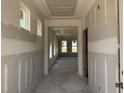 Bright hallway with tray ceiling, recessed lighting, and large windows at 264 Meadowbark Bnd # 43, Garner, NC 27529