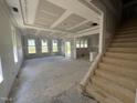 Spacious living room featuring a staircase, multiple windows, and ample natural light at 264 Meadowbark Bnd # 43, Garner, NC 27529