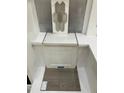 Sample board of a bathroom's tile selections features a hexagon accent tile, a wood-look plank floor, and white cabinet at 264 Meadowbark Bnd # 43, Garner, NC 27529