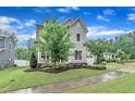 Charming two-story home with a manicured lawn, beautiful foliage and an attached garage at 2721 Jazzy St, New Hill, NC 27562