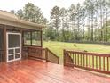 Large, stained wooden back deck overlooking large back yard at 30 Cole Creek Way, Franklinton, NC 27525