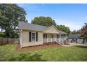 Inviting home with a well-manicured lawn and a classic design at 304 S Smith St, Clayton, NC 27520