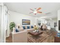 A bright living room featuring hardwood floors and a large window that provides abundant natural light at 307 Millbrook Dr, Pittsboro, NC 27312