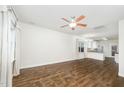 Open-concept living room featuring hardwood floors and a ceiling fan at 307 Millbrook Dr, Pittsboro, NC 27312