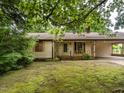 Charming one-story house surrounded by lush trees at 307 Sunset Dr, Elon, NC 27244