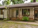 Inviting front porch with brick steps and wood railing at 307 Sunset Dr, Elon, NC 27244
