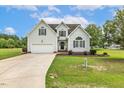Attractive home with a well-maintained lawn, mature trees, and traditional design elements at 40 Breckenridge Pl, Dunn, NC 28334