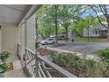 View from the porch overlooking parking and green spaces, highlighting a peaceful community at 4658 Fawnbrook Cir, Raleigh, NC 27612