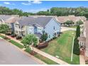 Aerial view of a lovely home with mature trees and landscaping in a desirable neighborhood at 533 Duchart Ln, Fuquay Varina, NC 27526