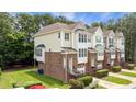 Features include a well-maintained lawn, complemented by brick and siding exteriors, plus a small balcony at 5503 Silver Moon Ln, Raleigh, NC 27606