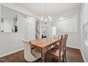 Cozy dining area with wood table set, chandelier, and easy access to other rooms at 68 Holly Berry Ln, Durham, NC 27703
