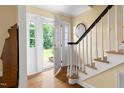 Inviting foyer with hardwood floors and a staircase leading to the upper level at 816 Miller Rd, Hillsborough, NC 27278