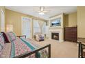 Cozy main bedroom with fireplace and private balcony access at 9808 Rainsong Dr, Wake Forest, NC 27587